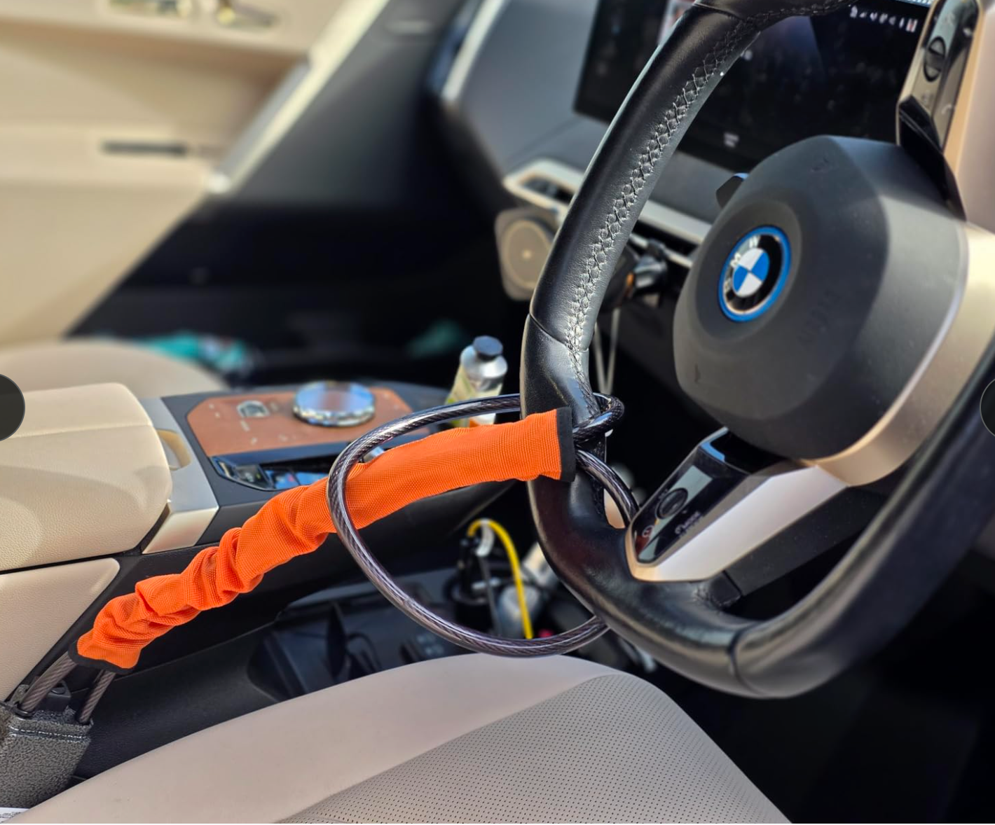 SteerShield anti-theft steering wheel lock fitted to a car
SteerShield steel cable resisting bolt cutters
SteerShield hardened lock core close-up
SteerShield steering wheel and seat belt lock universal fit
Driver installing SteerShield car security lock in seconds