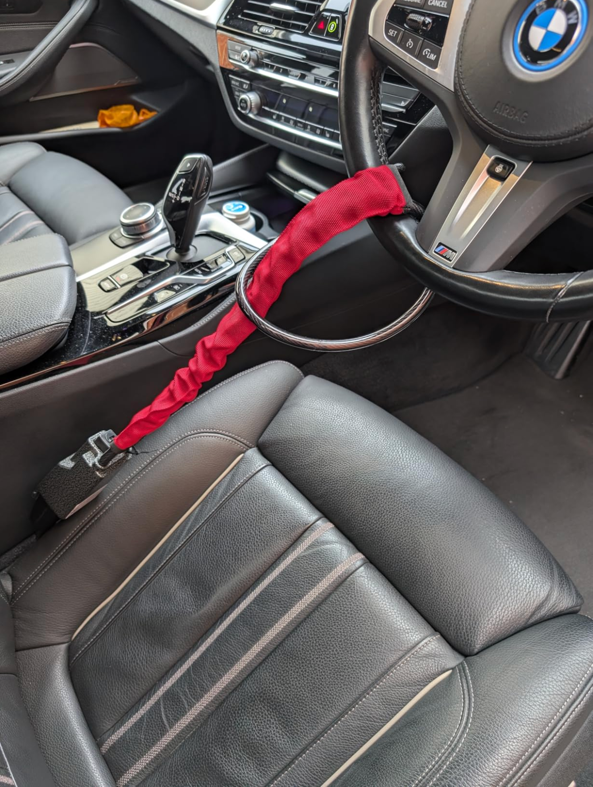 SteerShield anti-theft steering wheel lock fitted to a car
SteerShield steel cable resisting bolt cutters
SteerShield hardened lock core close-up
SteerShield steering wheel and seat belt lock universal fit
Driver installing SteerShield car security lock in seconds