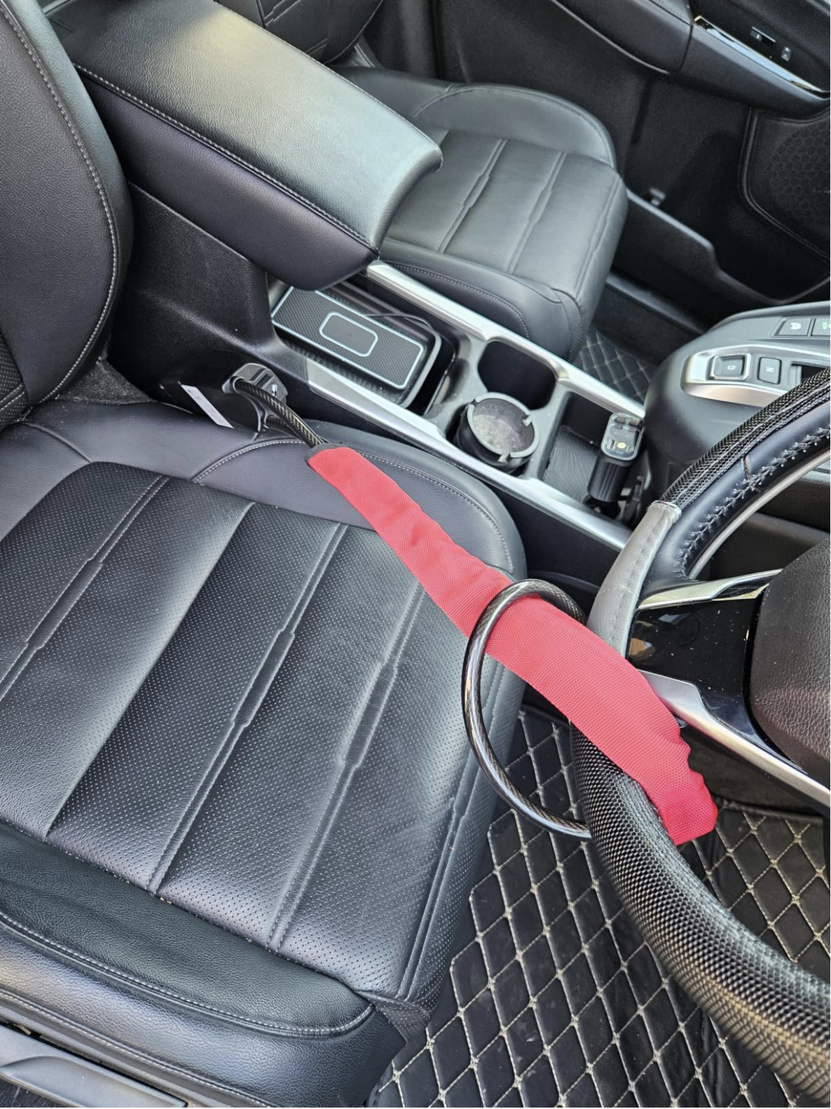 SteerShield anti-theft steering wheel lock fitted to a car
SteerShield steel cable resisting bolt cutters
SteerShield hardened lock core close-up
SteerShield steering wheel and seat belt lock universal fit
Driver installing SteerShield car security lock in seconds