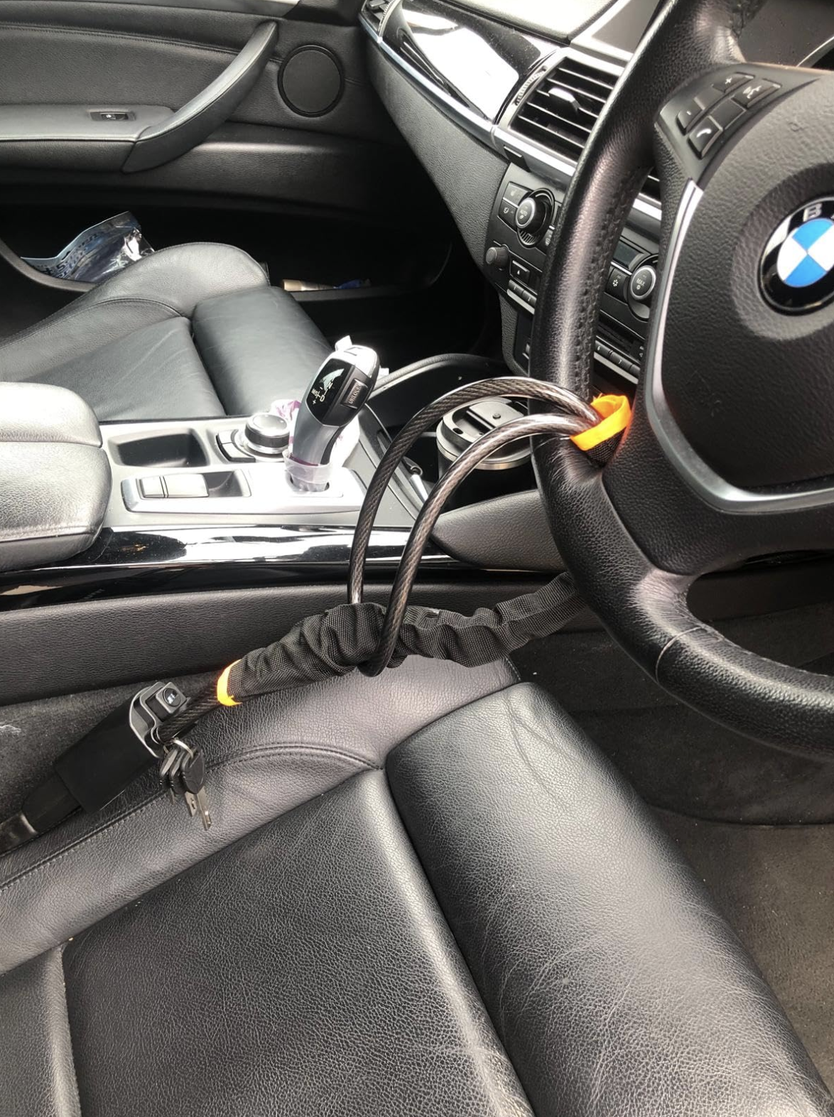 SteerShield anti-theft steering wheel lock fitted to a car
SteerShield steel cable resisting bolt cutters
SteerShield hardened lock core close-up
SteerShield steering wheel and seat belt lock universal fit
Driver installing SteerShield car security lock in seconds